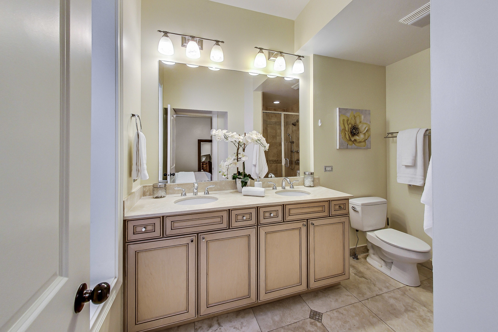 5219 North Winthrop Avenue, Unit 2N Chicago, IL 60640 - Photo 21 of 32 a bathroom with a granite countertop sink a toilet and a mirror