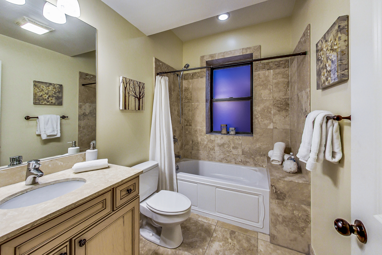 5219 North Winthrop Avenue, Unit 2N Chicago, IL 60640 - Photo 25 of 32 a bathroom with a granite countertop sink a toilet and shower