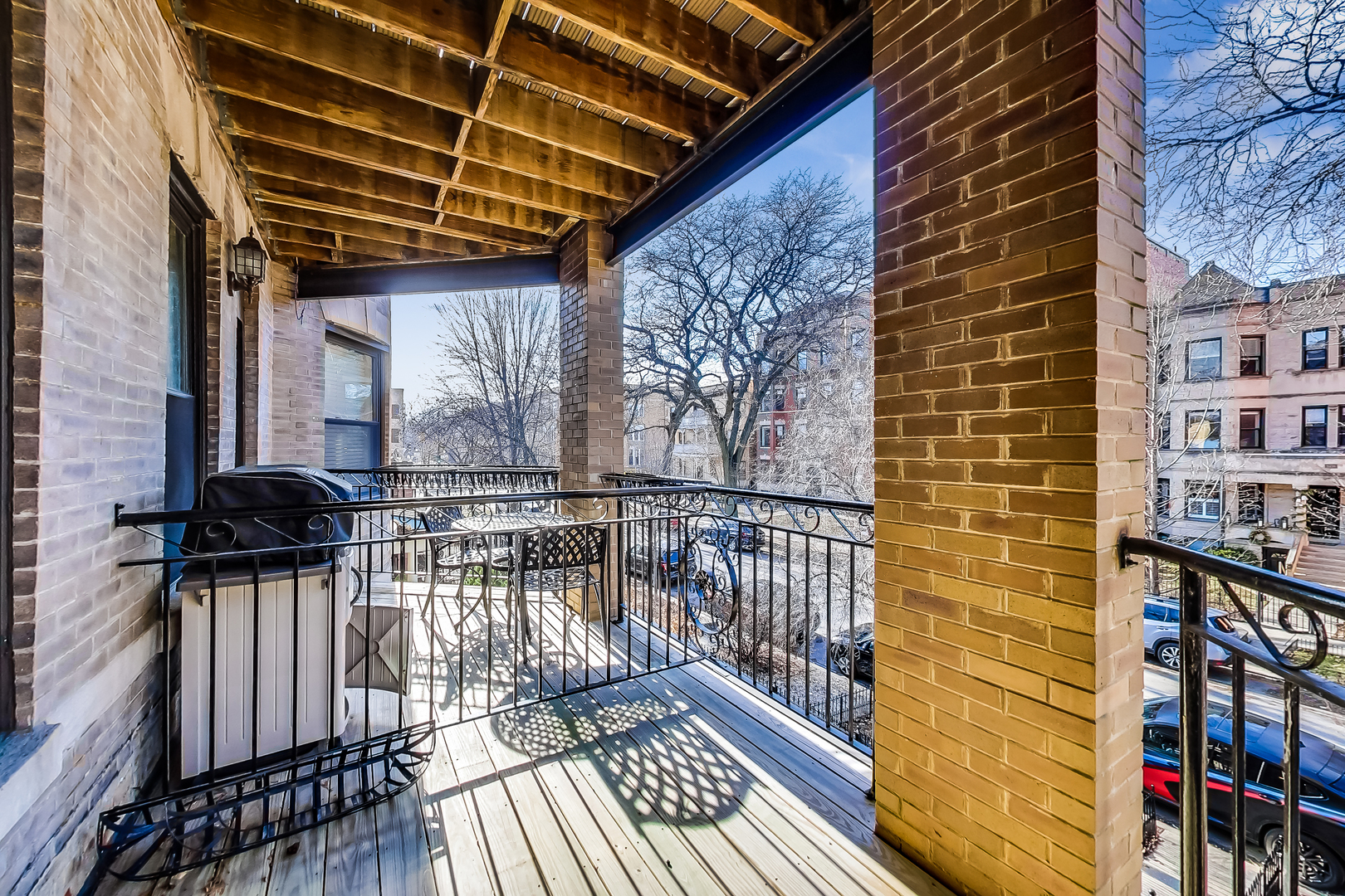 5219 North Winthrop Avenue, Unit 2N Chicago, IL 60640 - Photo 28 of 32 a view of balcony with wooden floor and outdoor seating