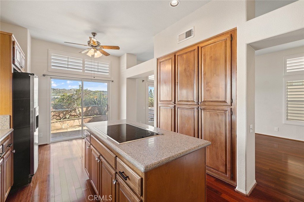 33686 Bridgehampton Drive Dana Point, CA 92629 - Photo 11 of 29 a kitchen with a stove a refrigerator a sink and wooden floor
