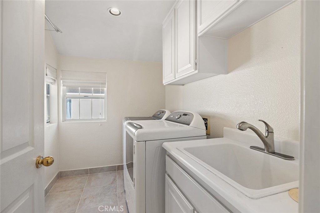 33686 Bridgehampton Drive Dana Point, CA 92629 - Photo 15 of 29 a utility room with dryer and washer