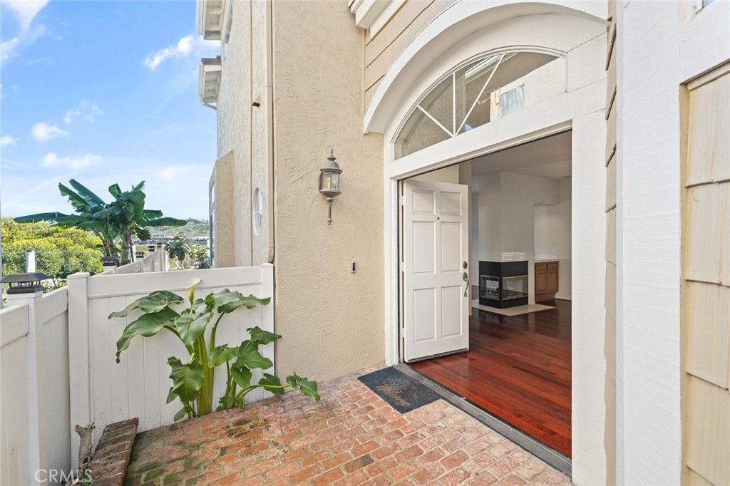33686 Bridgehampton Drive Dana Point, CA 92629 - Photo 2 of 29 a view of a hallway view with wooden floor and a potted plant