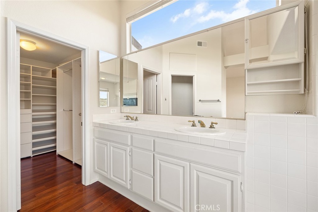 33686 Bridgehampton Drive Dana Point, CA 92629 - Photo 23 of 29 a bathroom with a double vanity sink and a mirror