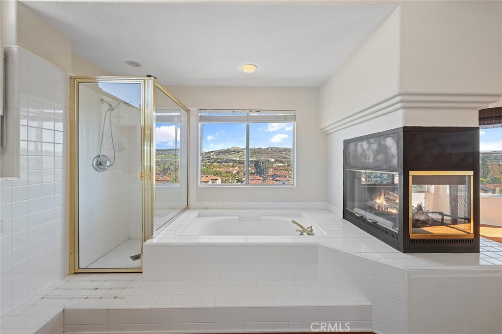 33686 Bridgehampton Drive Dana Point, CA 92629 - Photo 25 of 29 a bathroom with a bathtub and a shower
