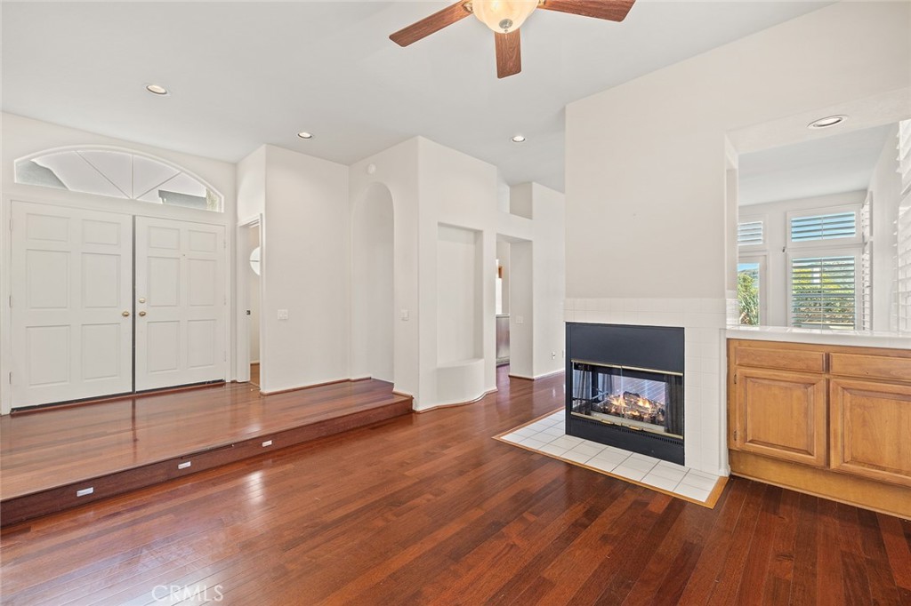 33686 Bridgehampton Drive Dana Point, CA 92629 - Photo 4 of 29 a view of empty room with a fireplace and wooden floor