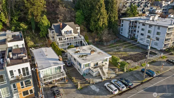 an aerial view of residential houses with outdoor space