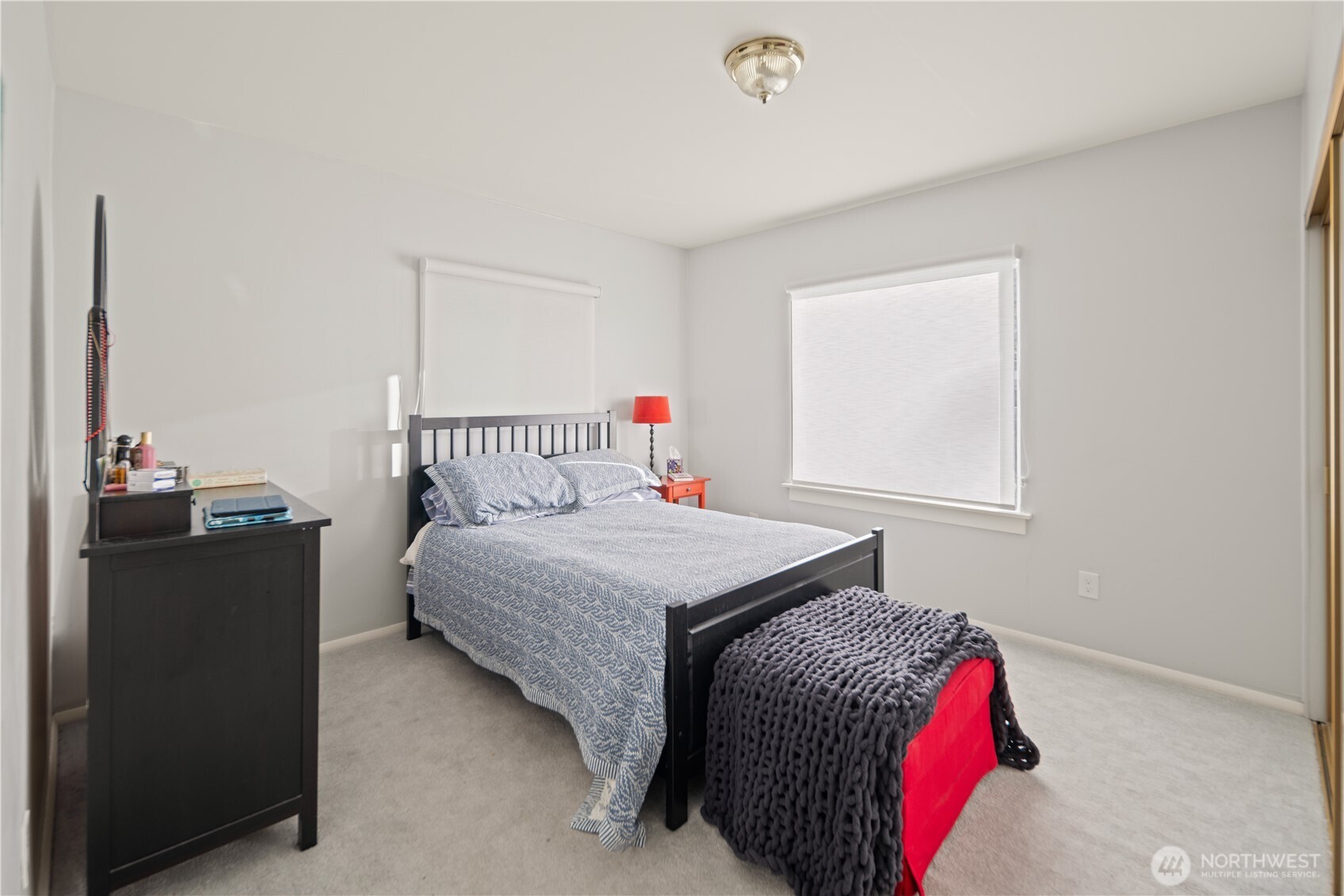 1788 Alki Avenue Southwest Seattle, WA 98116 - Photo 24 of 38 a bedroom with a bed and a window