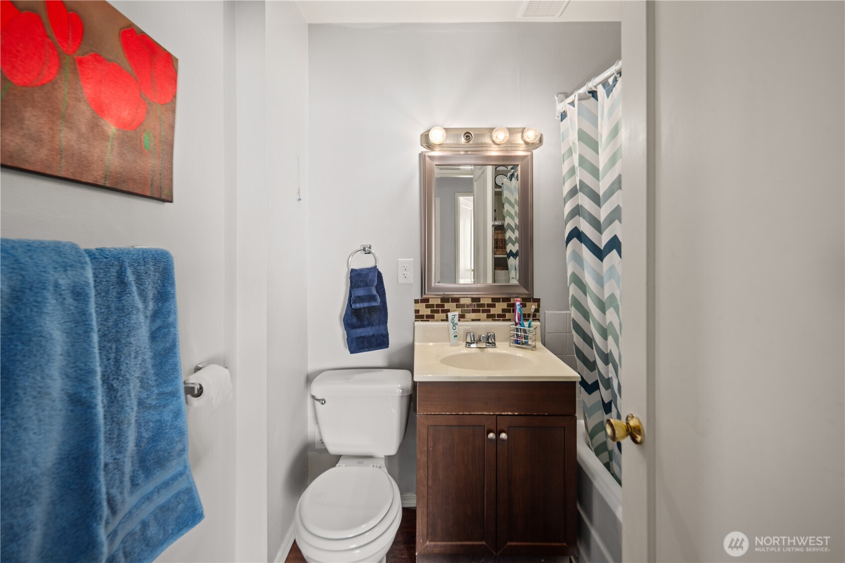1788 Alki Avenue Southwest Seattle, WA 98116 - Photo 26 of 38 a bathroom with a toilet sink and mirror