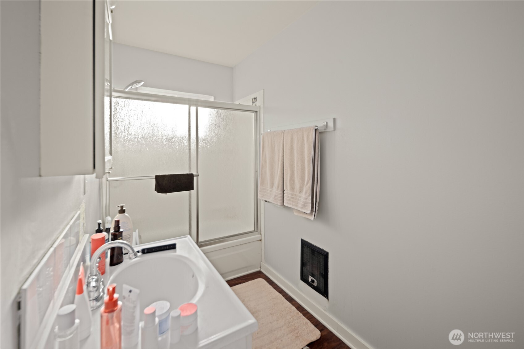 1788 Alki Avenue Southwest Seattle, WA 98116 - Photo 27 of 38 a bedroom with a bed and a window