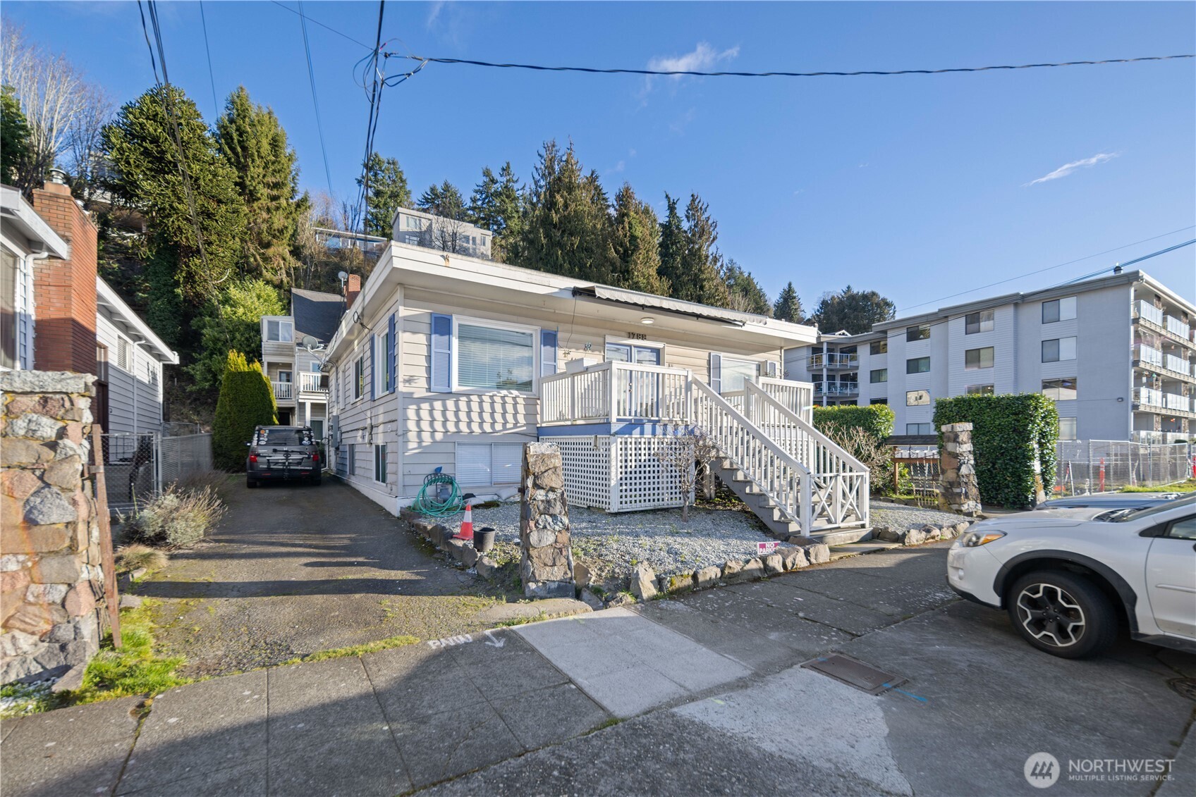 1788 Alki Avenue Southwest Seattle, WA 98116 - Photo 3 of 38 a view of a car park in front of a building