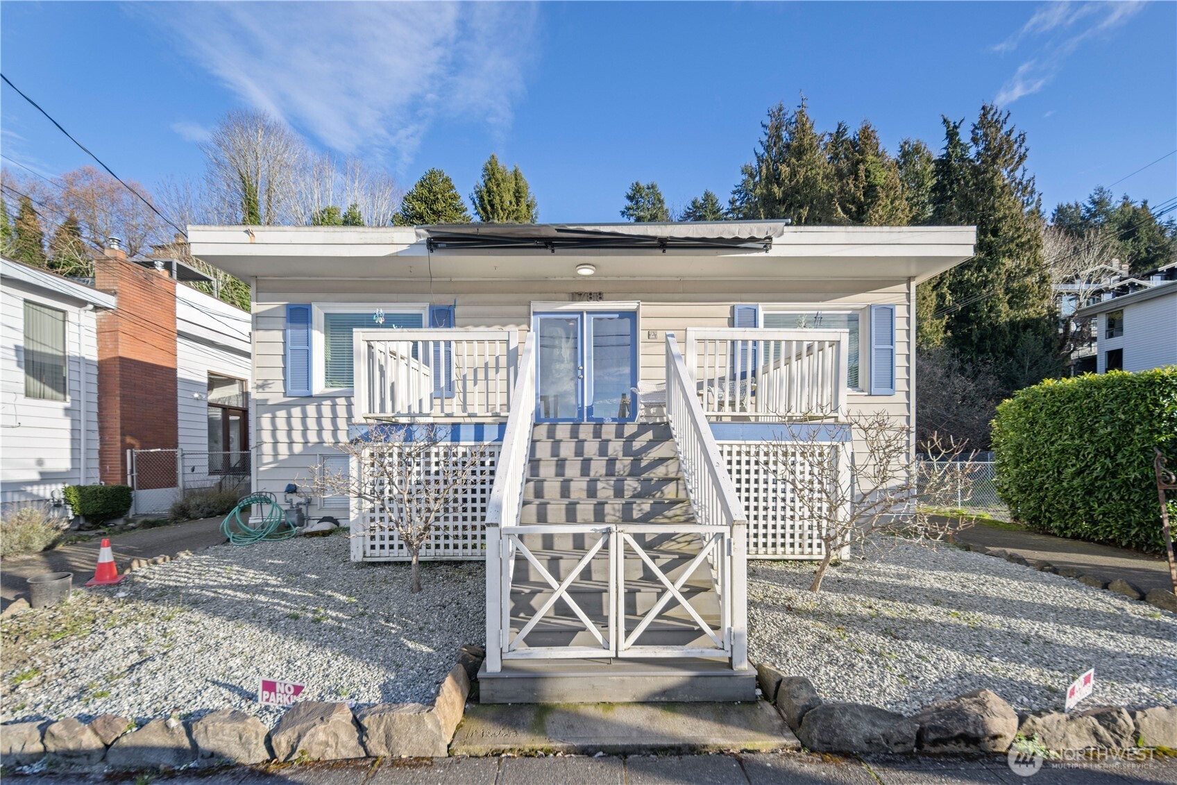1788 Alki Avenue Southwest Seattle, WA 98116 - Photo 5 of 38 a front view of a house with a tree