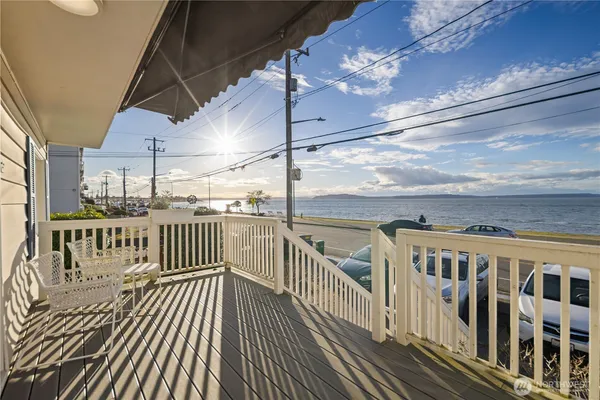 a view of a balcony with wooden floor
