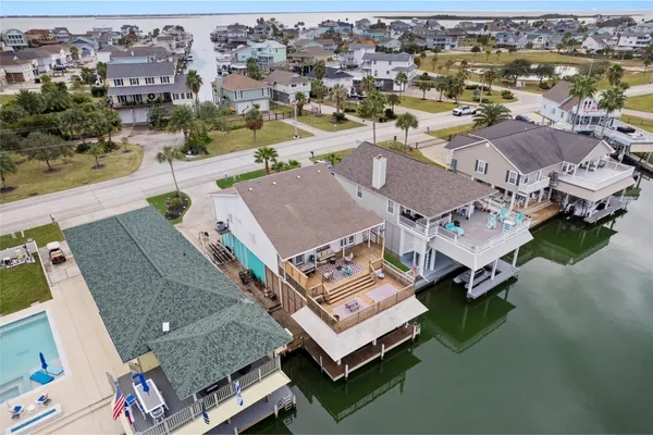 an aerial view of residential houses with outdoor space
