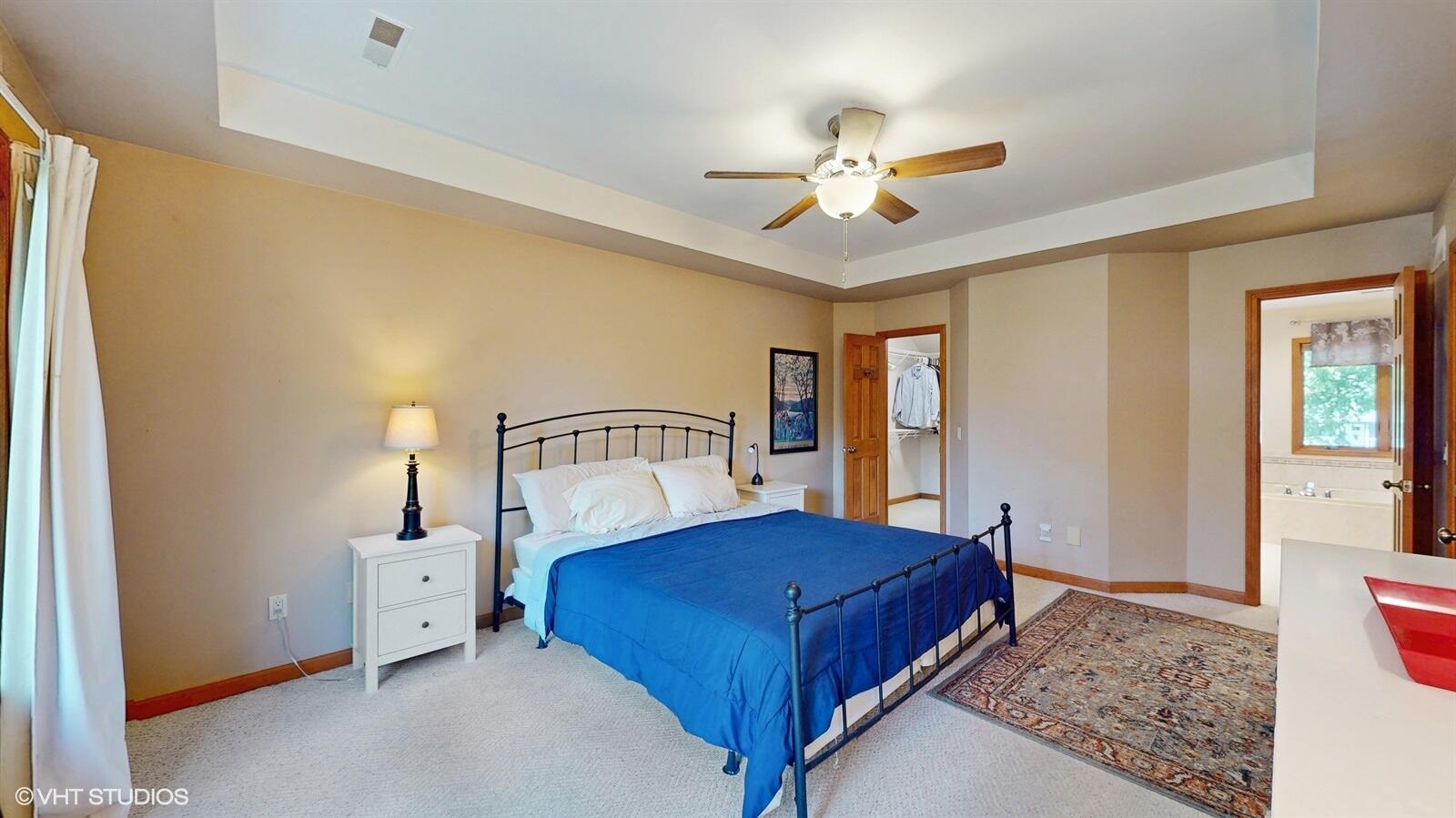 3908 Autumn Lane Valparaiso, IN 46385 - Photo 13 of 29 a bedroom with a large bed and a chandelier