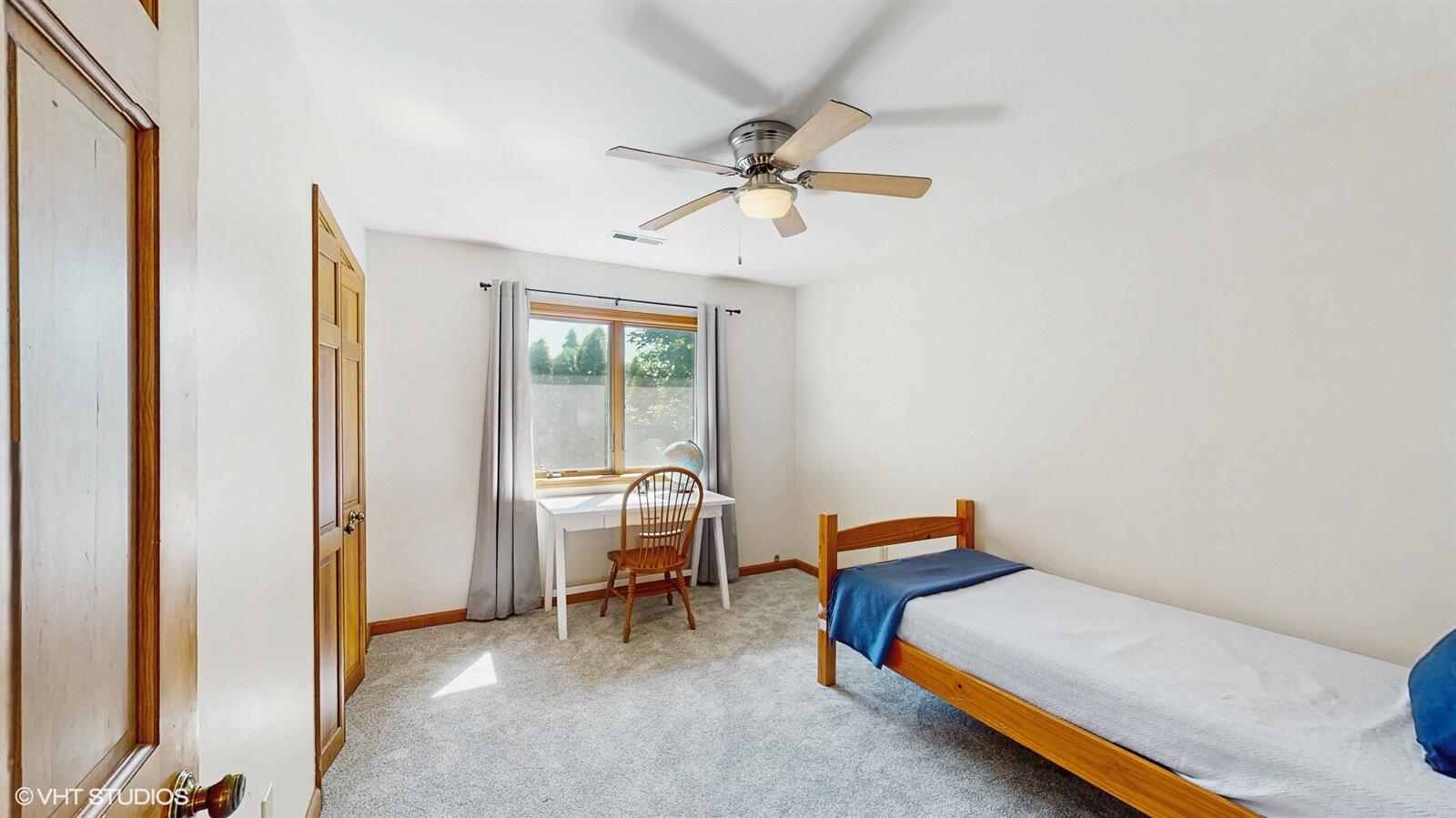 3908 Autumn Lane Valparaiso, IN 46385 - Photo 18 of 29 a bedroom with a bed and a chandelier