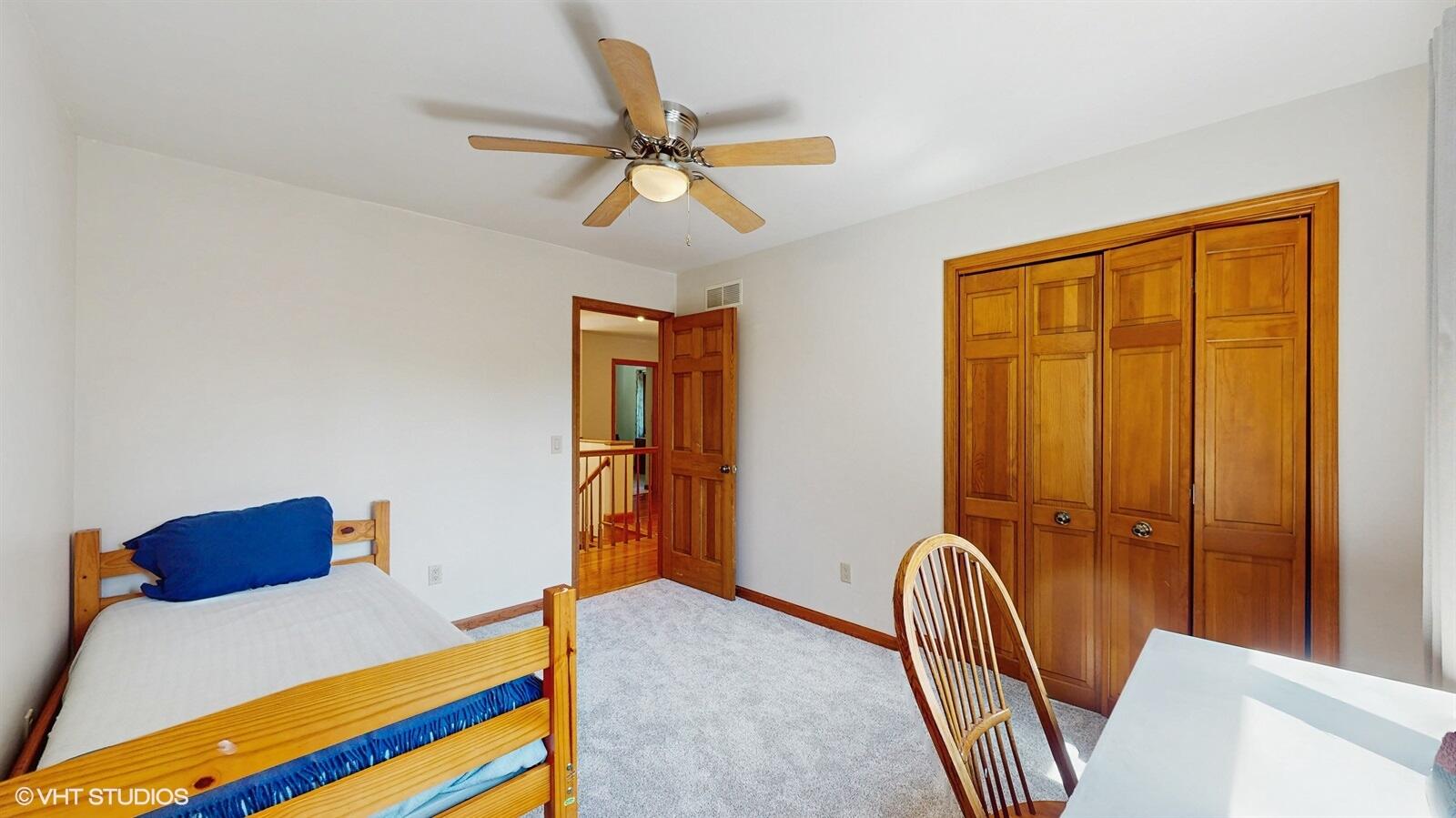 3908 Autumn Lane Valparaiso, IN 46385 - Photo 19 of 29 a bedroom with a bed and a chandelier