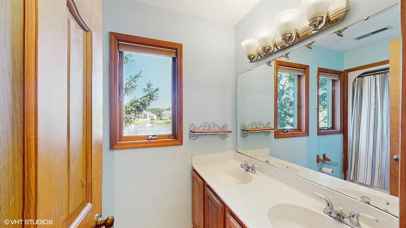 3908 Autumn Lane Valparaiso, IN 46385 - Photo 21 of 29 a bathroom with a sink and a mirror