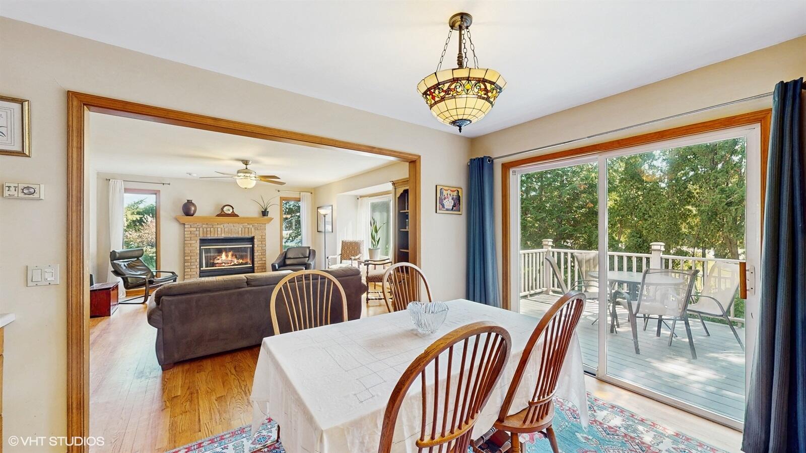 3908 Autumn Lane Valparaiso, IN 46385 - Photo 4 of 29 a view of a dining room with furniture a chandelier and wooden floor