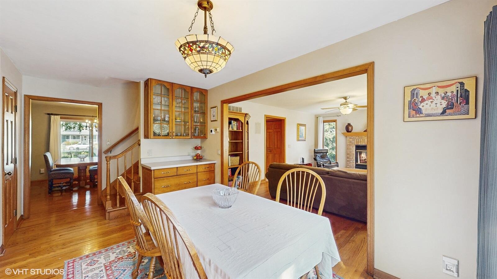 3908 Autumn Lane Valparaiso, IN 46385 - Photo 5 of 29 a dining room with furniture a chandelier and wooden floor