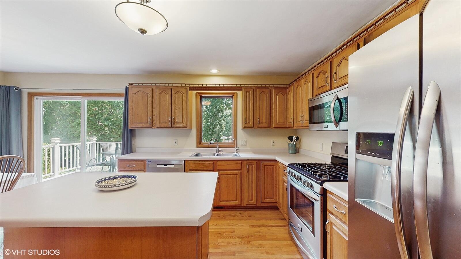 3908 Autumn Lane Valparaiso, IN 46385 - Photo 7 of 29 a kitchen with stainless steel appliances granite countertop a sink stove and refrigerator