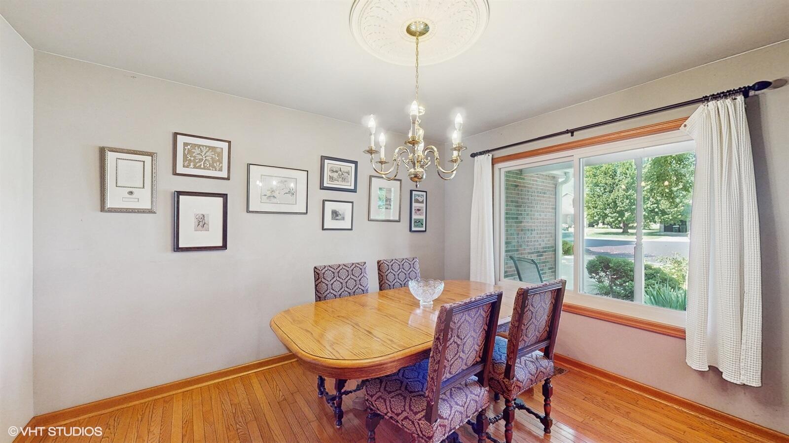 3908 Autumn Lane Valparaiso, IN 46385 - Photo 8 of 29 a view of a dining room with furniture window and wooden floor