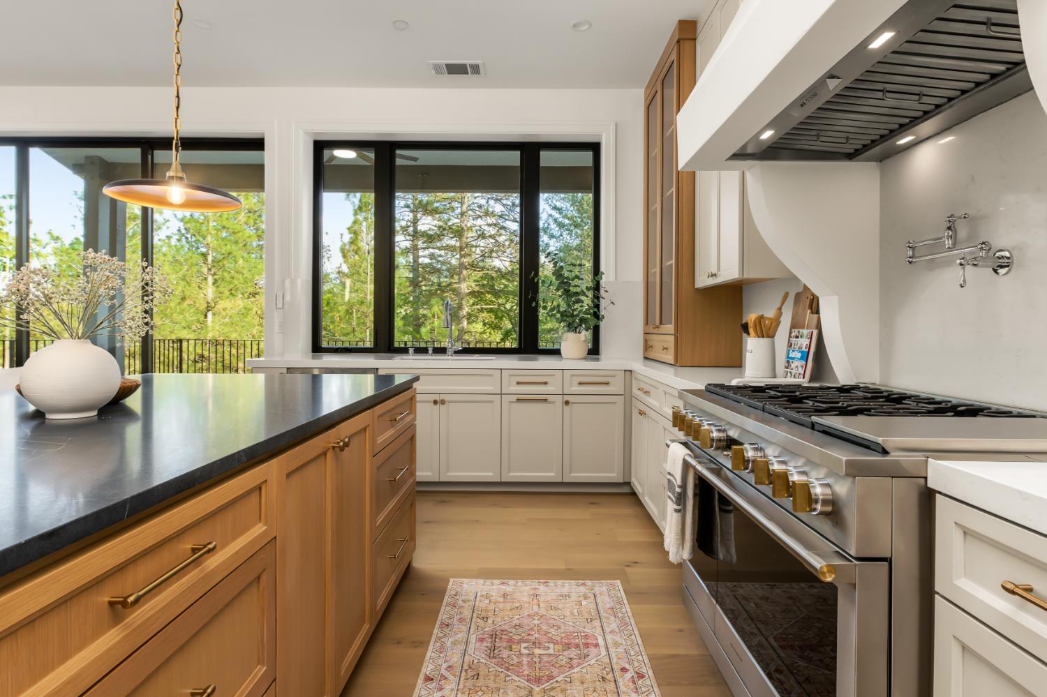 1632 The Point Meadow Vista, CA 95722 - Photo 19 of 60 a kitchen with a stove a sink and a large window