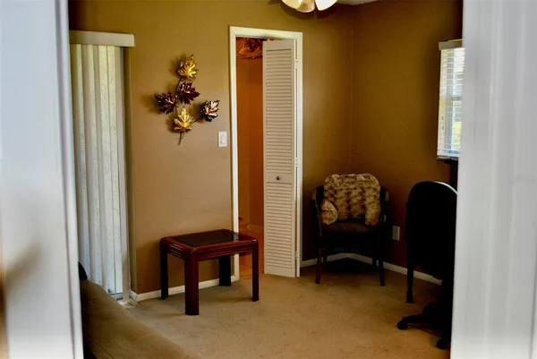 a bathroom with a toilet and a shower curtain