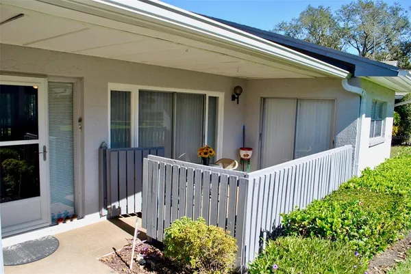 a view of a house with a small yard
