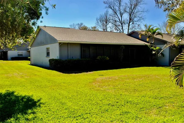 a view of a house with a yard