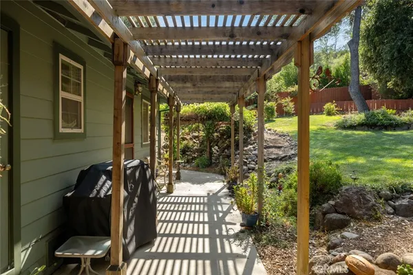 a view of a bench in the backyard
