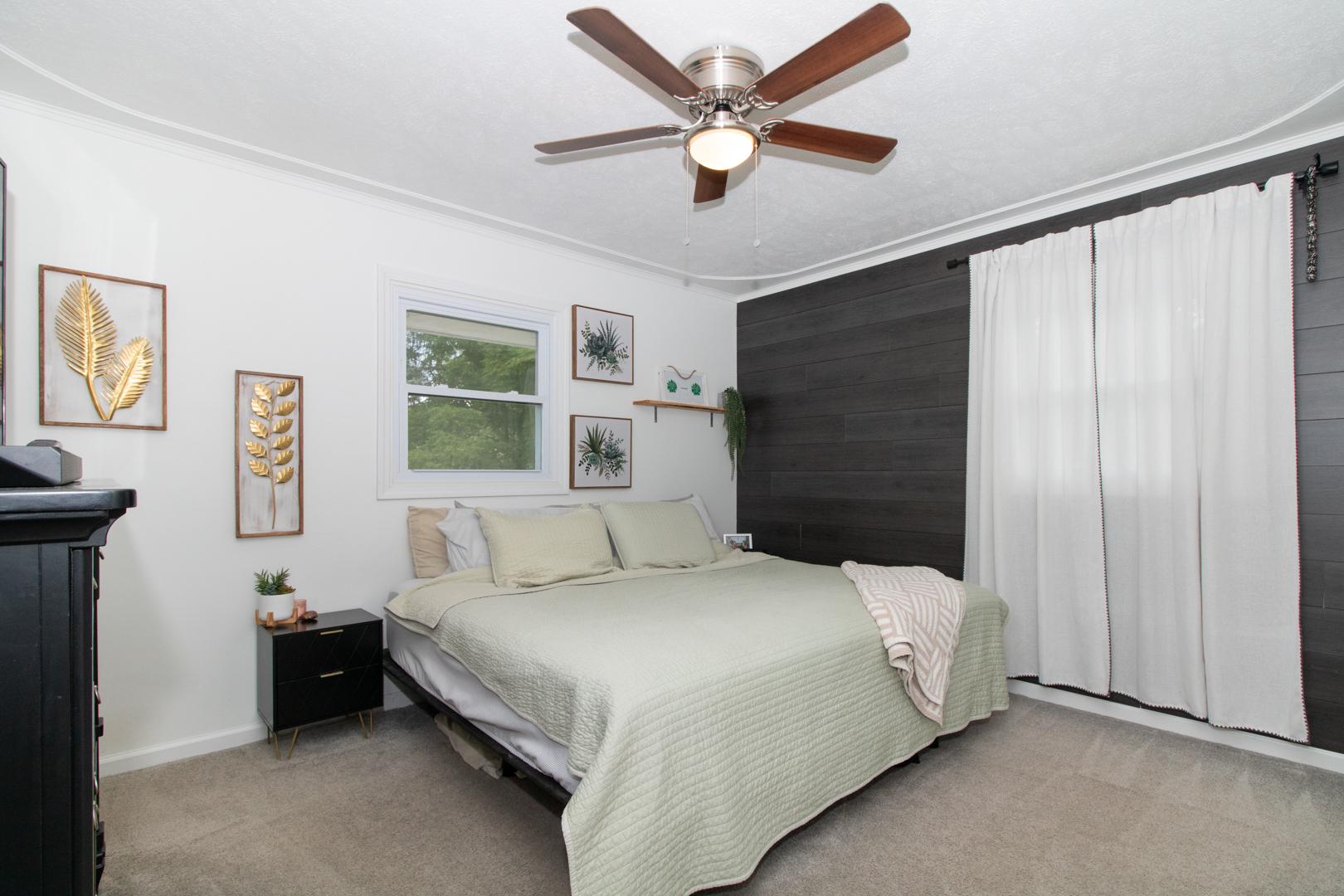 211 Sandra Lane Normal, IL 61761 - Photo 11 of 44 a bedroom with a bed and a chandelier