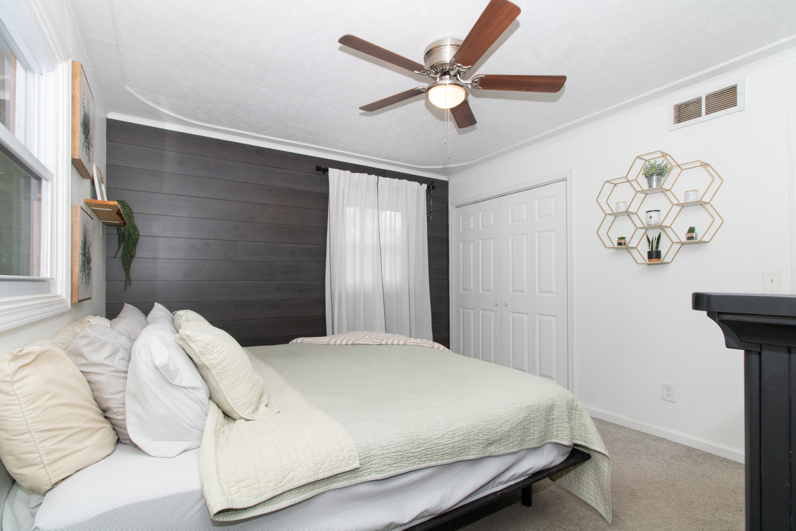 211 Sandra Lane Normal, IL 61761 - Photo 13 of 44 a bedroom with a bed and a chandelier