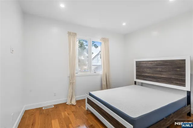 a room with a bed and a window