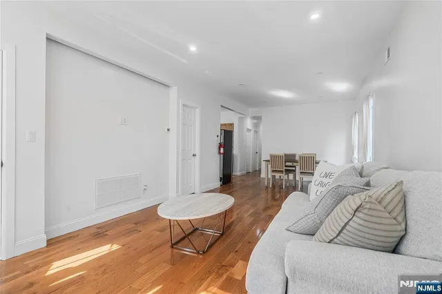 a living room with furniture and a table