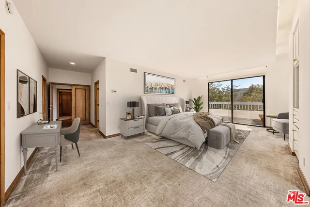 a bed room with a bed and a large window