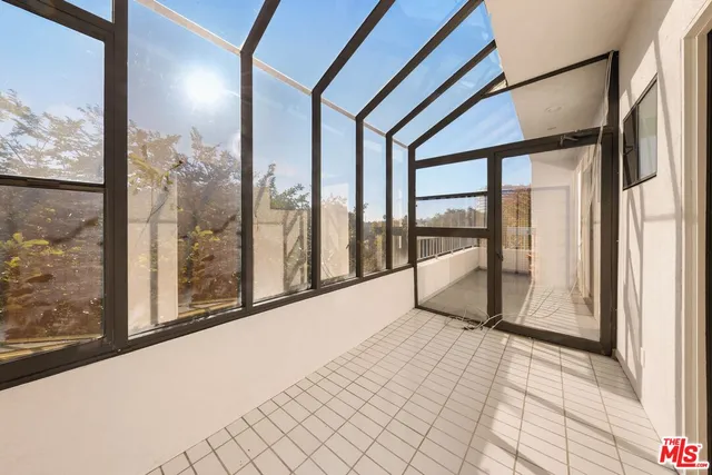 a view of a room with a floor to ceiling window