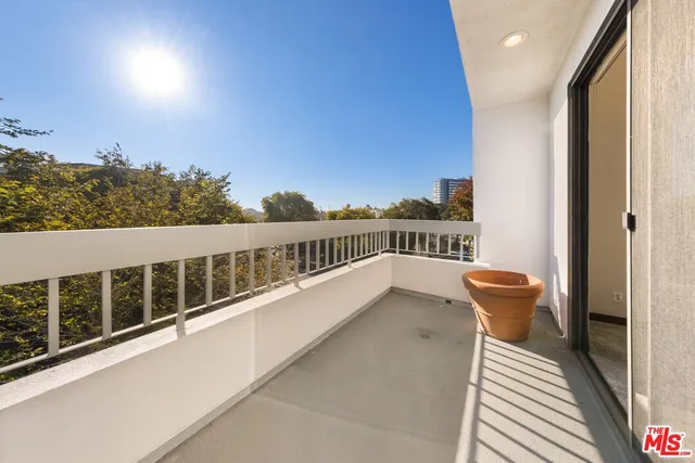 a view of balcony with furniture