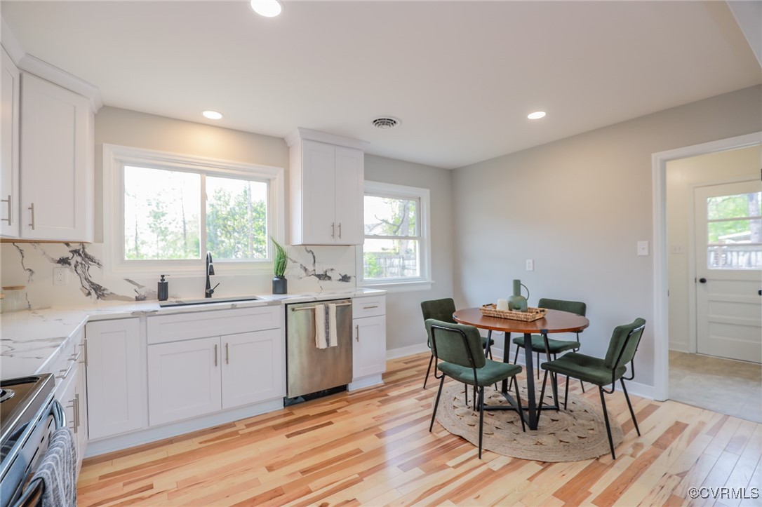 6626 Willson Road Henrico, VA 23231 - Photo 12 of 43 a kitchen with a table chairs sink and cabinets