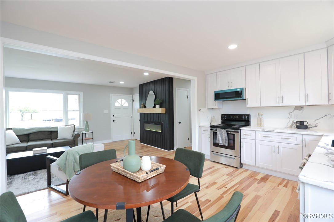 6626 Willson Road Henrico, VA 23231 - Photo 18 of 43 a kitchen with a table and chairs in it