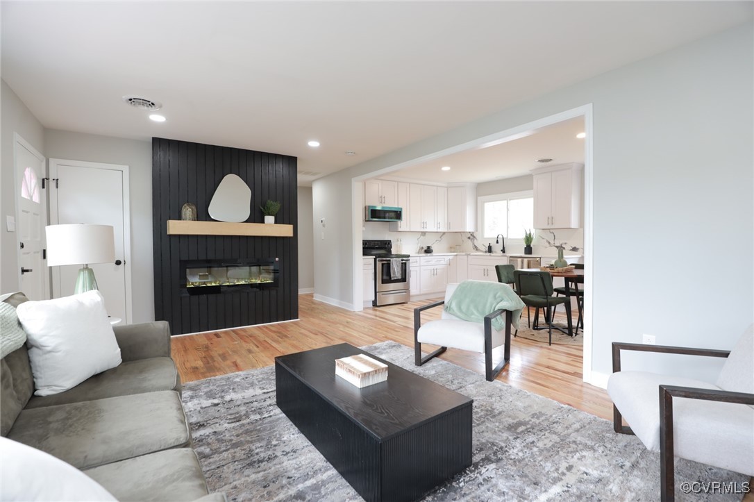 6626 Willson Road Henrico, VA 23231 - Photo 2 of 43 a living room with furniture and a fireplace