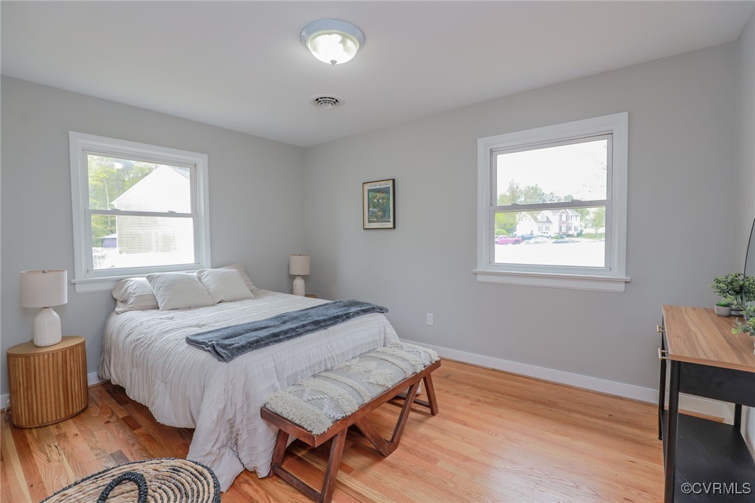 6626 Willson Road Henrico, VA 23231 - Photo 21 of 43 a bedroom with a bed and wooden floor