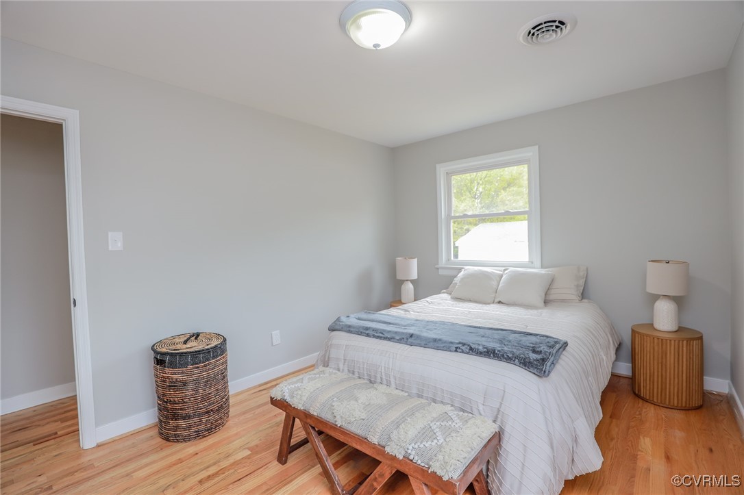 6626 Willson Road Henrico, VA 23231 - Photo 22 of 43 a bedroom with a bed and wooden floor