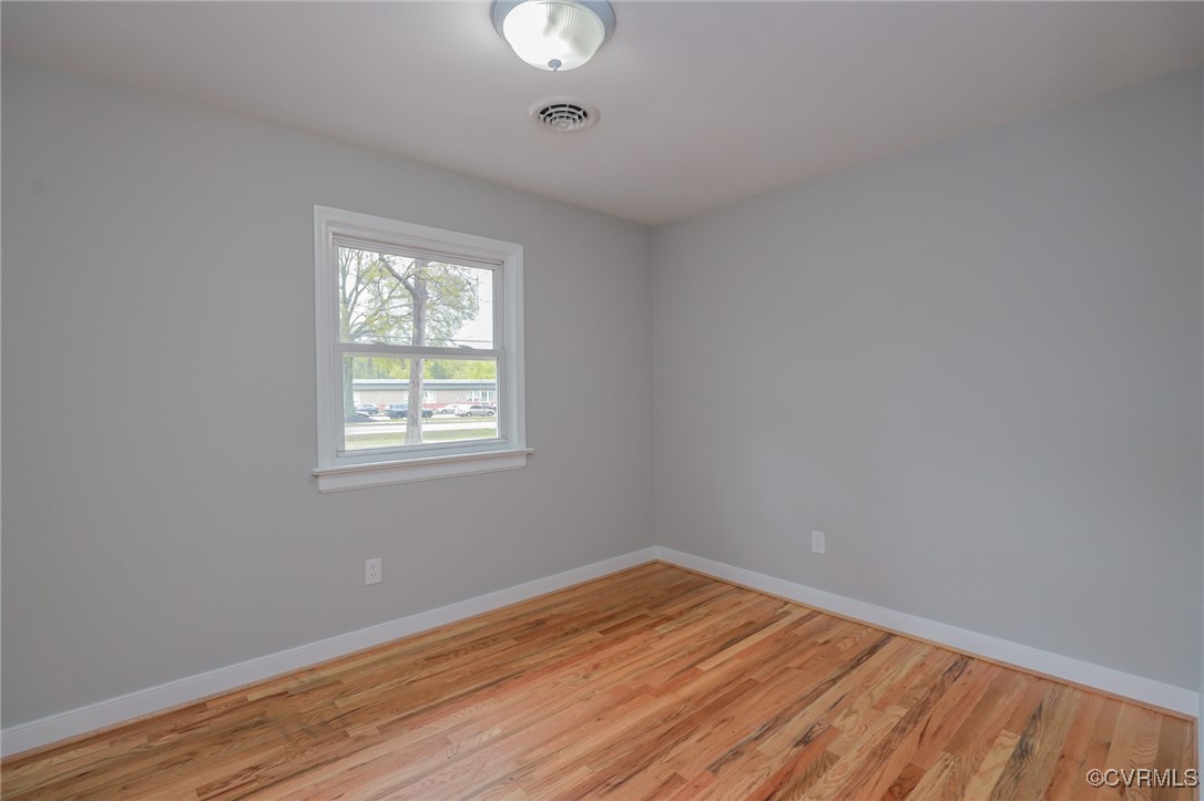 6626 Willson Road Henrico, VA 23231 - Photo 23 of 43 wooden floor in an empty room with a window