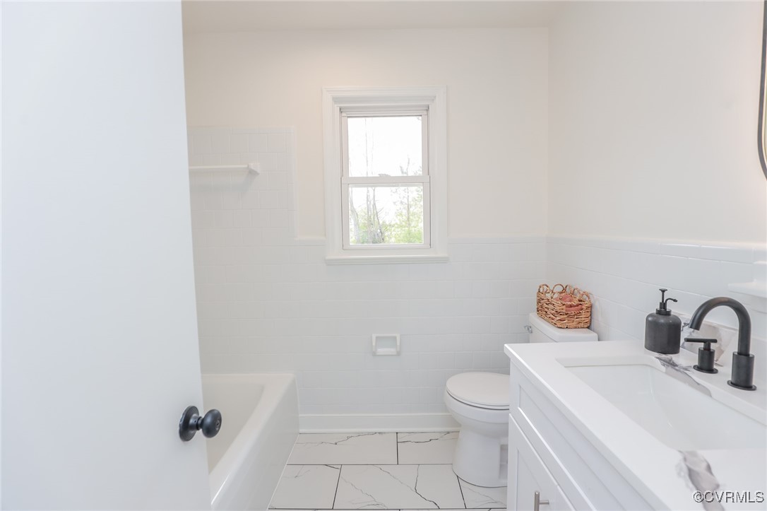 6626 Willson Road Henrico, VA 23231 - Photo 31 of 43 a bathroom with a sink a toilet and a window