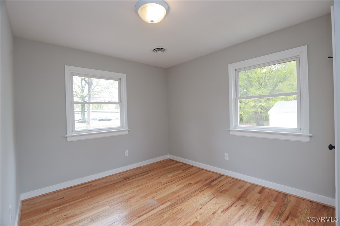 6626 Willson Road Henrico, VA 23231 - Photo 32 of 43 a view of empty room with wooden floor