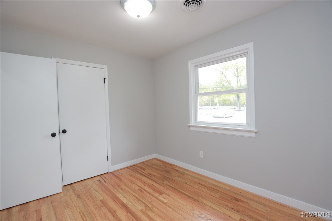 6626 Willson Road Henrico, VA 23231 - Photo 34 of 43 a view of an empty room with wooden floor and a window