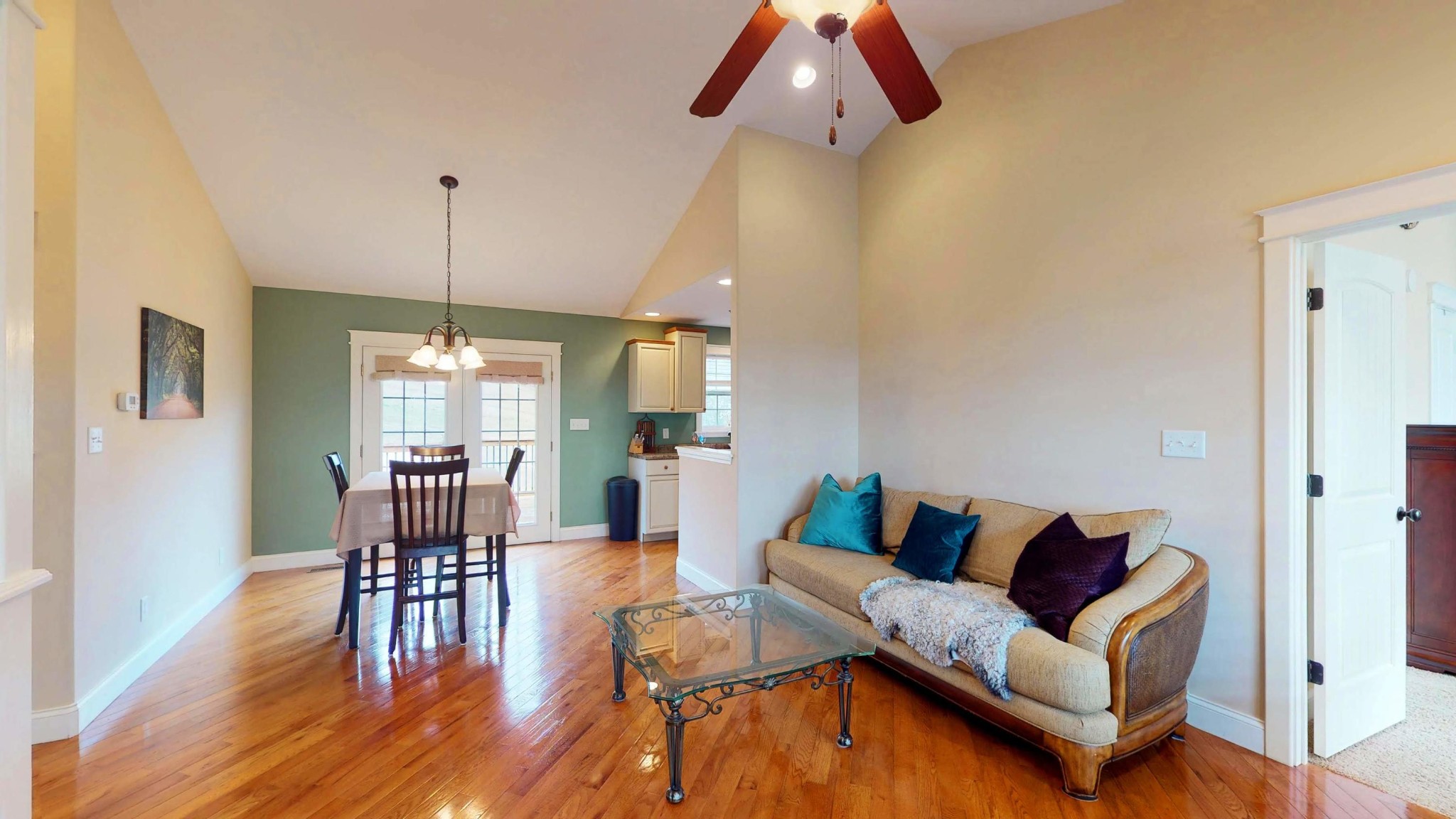 2797 Musser Road Morristown, TN 37813 - Photo 2 of 33 a living room with furniture a dining table and a chandelier