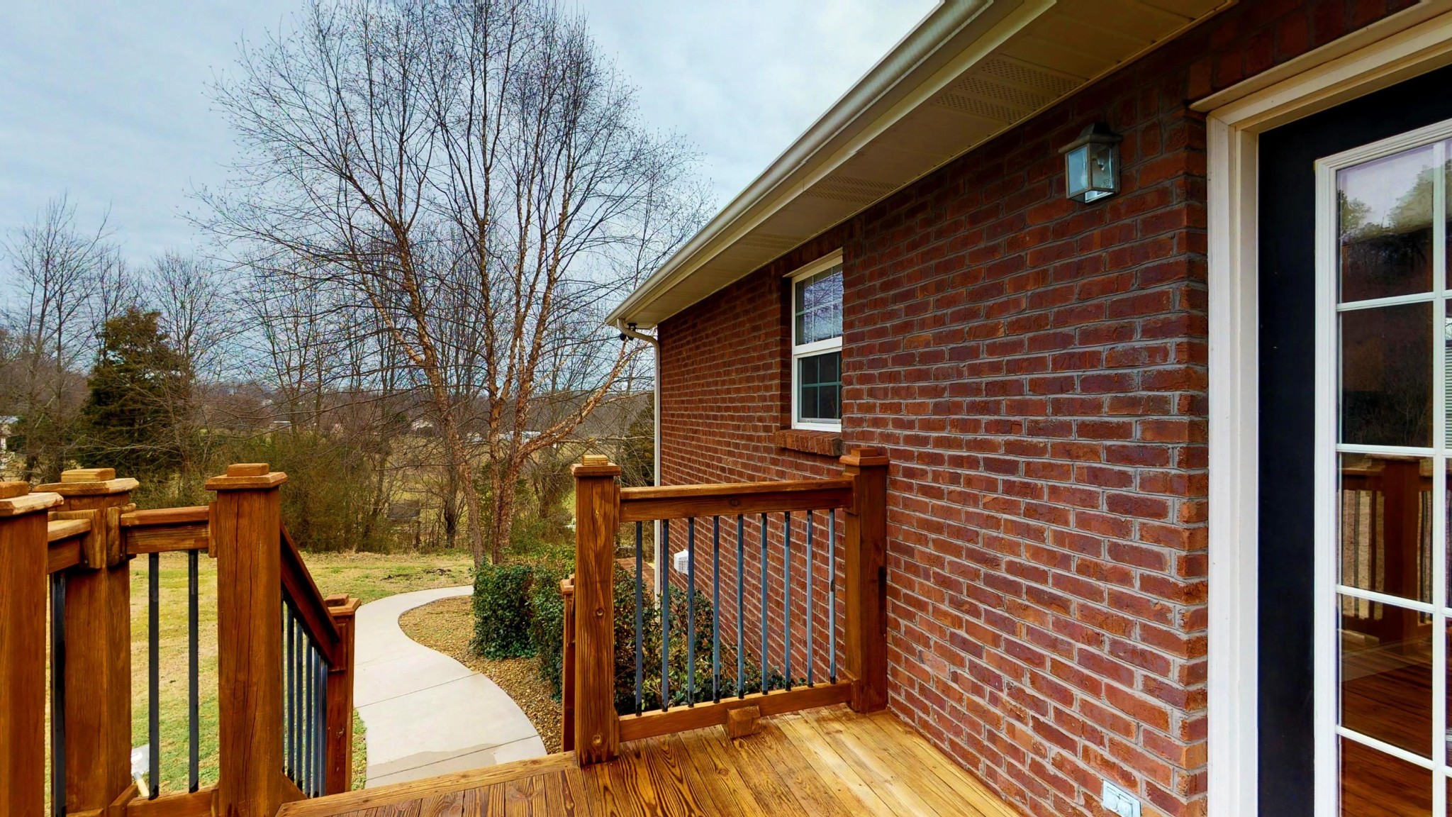 2797 Musser Road Morristown, TN 37813 - Photo 28 of 33 a view of a brick house with wooden fence and floor