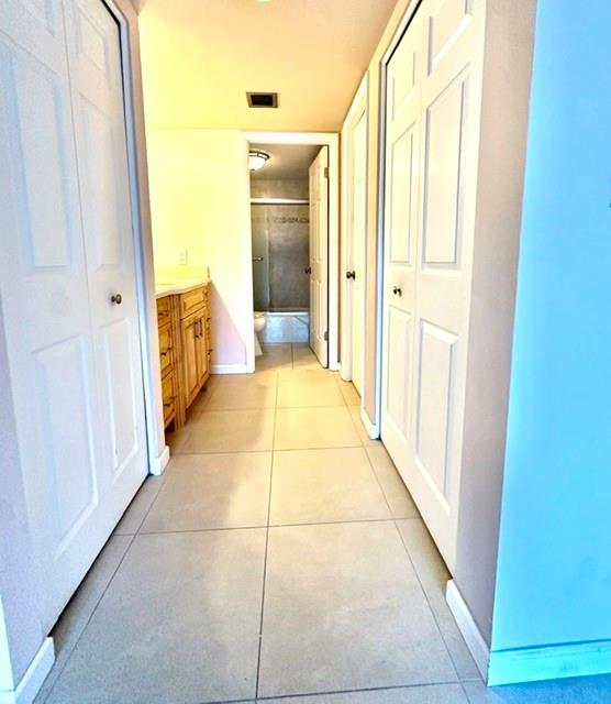 10777 West Sample Road, Unit 418 Coral Springs, FL 33065 - Photo 13 of 21 a bathroom with a tub and shower