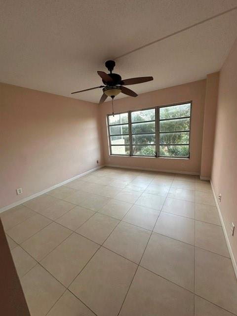 10777 West Sample Road, Unit 418 Coral Springs, FL 33065 - Photo 16 of 21 a view of an empty room with a window